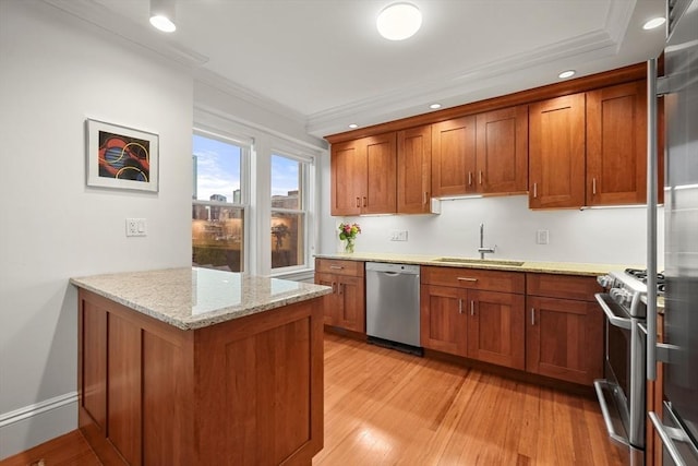 kitchen featuring sink, light stone counters, crown molding, light hardwood / wood-style floors, and appliances with stainless steel finishes