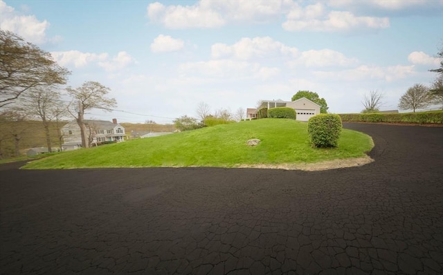 exterior space with a yard and a garage