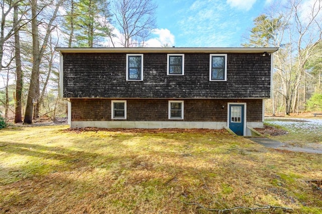 view of home's exterior with a yard