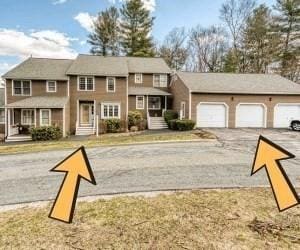 view of front of home featuring driveway and a garage