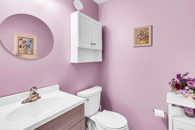 half bath with toilet and vanity