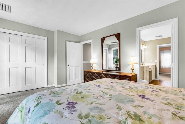 bedroom featuring multiple windows, visible vents, and a closet