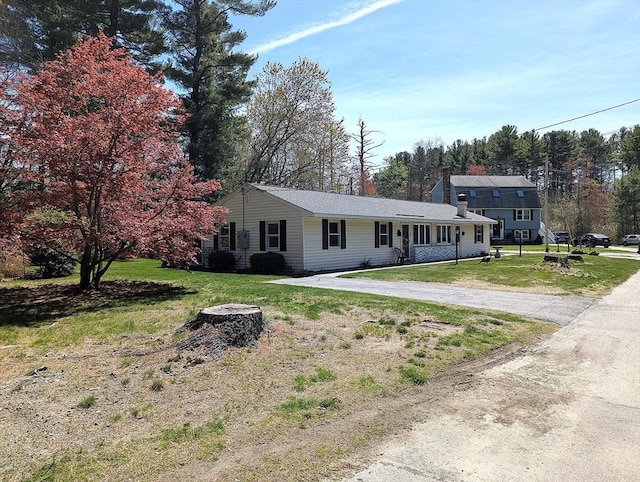 22 Newton Ave, Tewksbury, MA 01876 - view of front of house with a front yard and dirt driveway