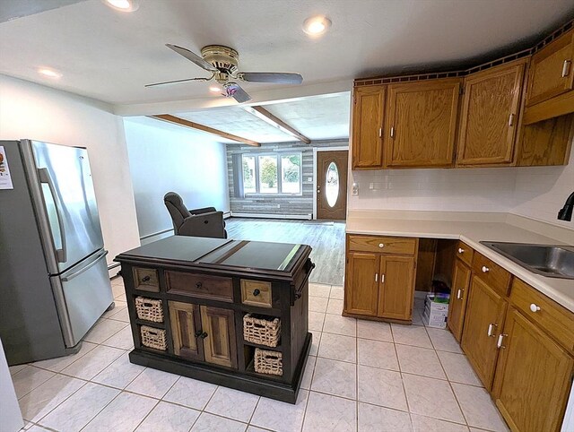 22 Newton Ave, Tewksbury, MA 01876 - kitchen featuring freestanding refrigerator, a ceiling fan, brown cabinetry, light tile patterned floors, and recessed lighting