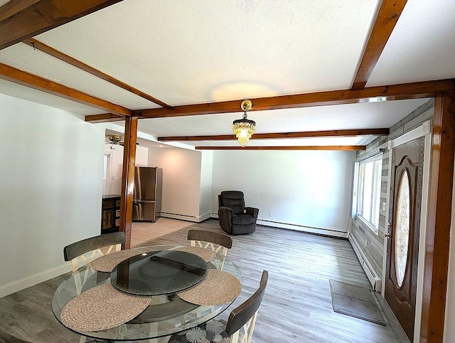 22 Newton Ave, Tewksbury, MA 01876 - dining area featuring a baseboard radiator, light wood-type flooring, beam ceiling, and a baseboard heating unit