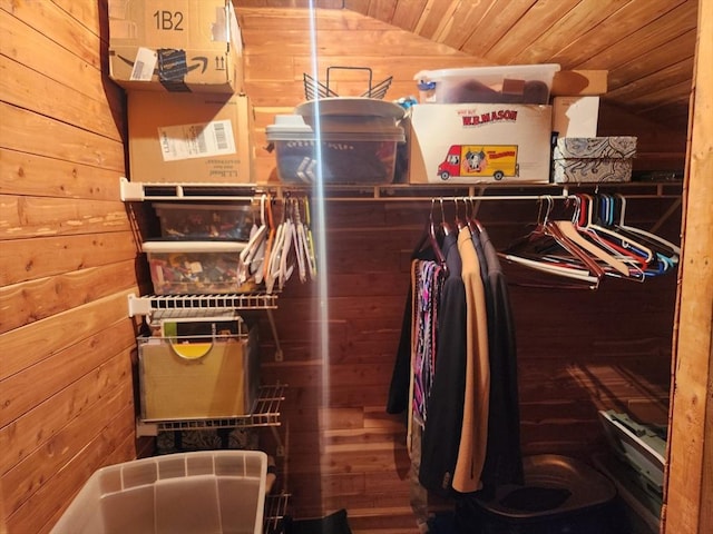 walk in closet with lofted ceiling