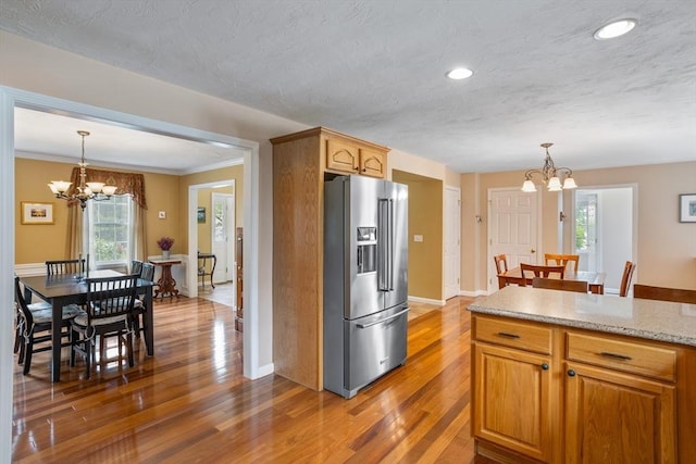 45 Taylor Rd, Maynard, MA 01754 - kitchen with high end fridge, a chandelier, plenty of natural light, recessed lighting, and ornamental molding