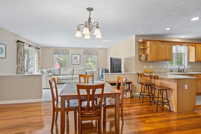 45 Taylor Rd, Maynard, MA 01754 - dining room with light wood finished floors, plenty of natural light, a chandelier, recessed lighting, and baseboards