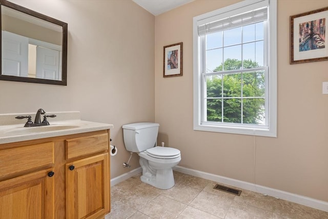 45 Taylor Rd, Maynard, MA 01754 - half bathroom featuring baseboards, vanity, toilet, and tile patterned flooring