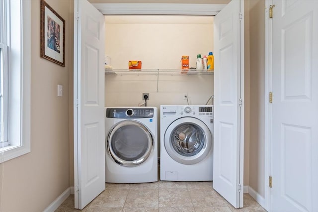45 Taylor Rd, Maynard, MA 01754 - washroom with washer and dryer, baseboards, and light tile patterned flooring