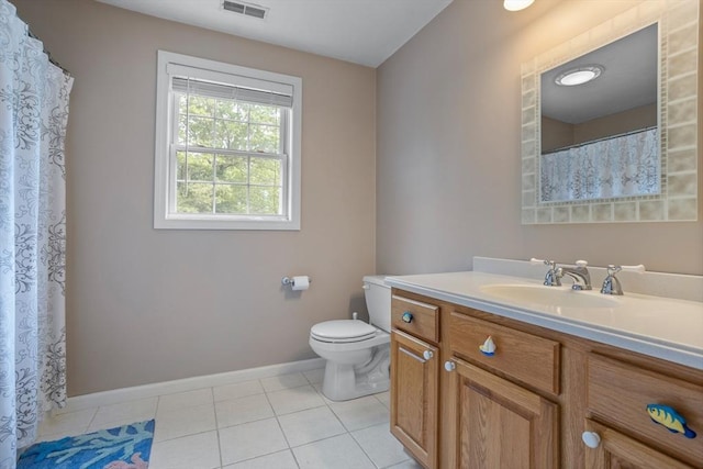 45 Taylor Rd, Maynard, MA 01754 - bathroom featuring vanity, toilet, tile patterned flooring, and baseboards