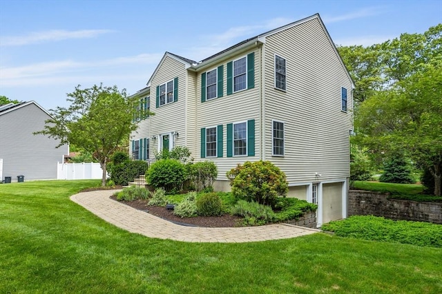 45 Taylor Rd, Maynard, MA 01754 - view of home's exterior with a lawn and a garage