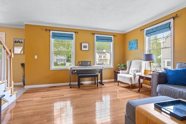45 Taylor Rd, Maynard, MA 01754 - living area with stairs, plenty of natural light, ornamental molding, light wood finished floors, and baseboards