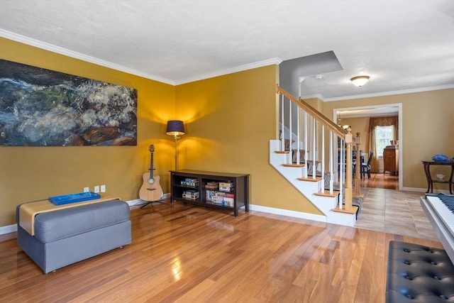 45 Taylor Rd, Maynard, MA 01754 - sitting room featuring crown molding, stairs, wood finished floors, and baseboards