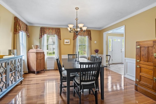 45 Taylor Rd, Maynard, MA 01754 - dining room with a chandelier, hardwood / wood-style floors, a wainscoted wall, and crown molding