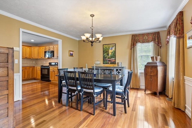 45 Taylor Rd, Maynard, MA 01754 - dining area featuring a chandelier, light wood-style flooring, and ornamental molding