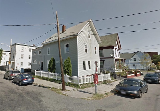 329 Essex St, Lynn, MA 01902 - townhome / multi-family property with a chimney and a residential view