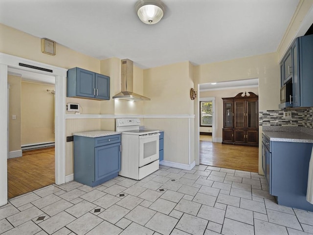 kitchen with a baseboard radiator, white electric stove, blue cabinets, and wall chimney range hood