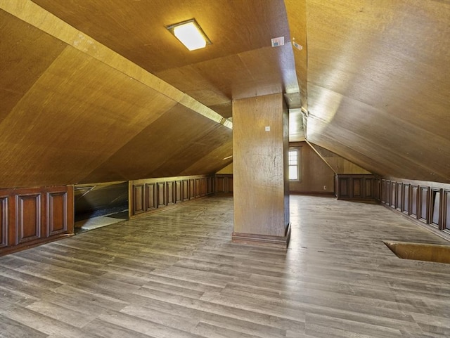 bonus room featuring lofted ceiling, wood finished floors, and wooden ceiling