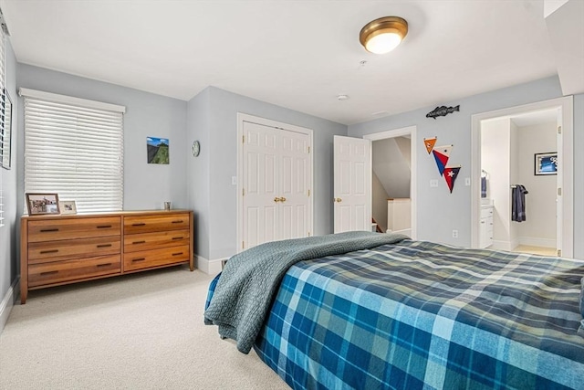 49 Intrepid Cir Unit 49, Marblehead, MA 01945 - bedroom with light carpet, baseboards, and a closet