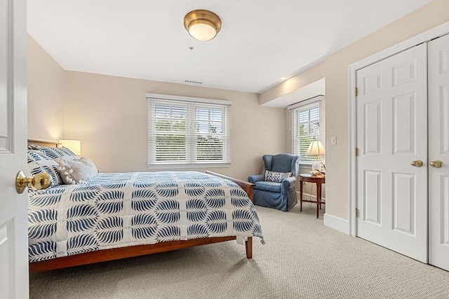 49 Intrepid Cir Unit 49, Marblehead, MA 01945 - carpeted bedroom featuring multiple windows and baseboards