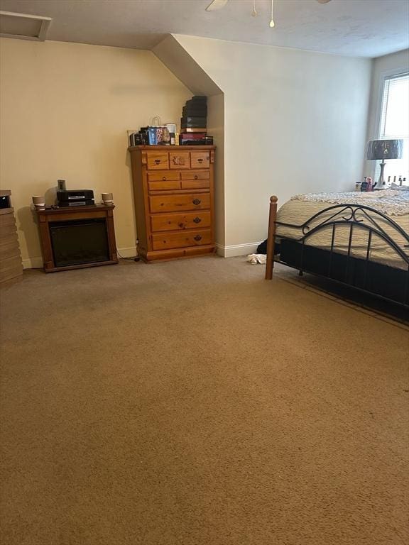 carpeted bedroom featuring a ceiling fan and baseboards