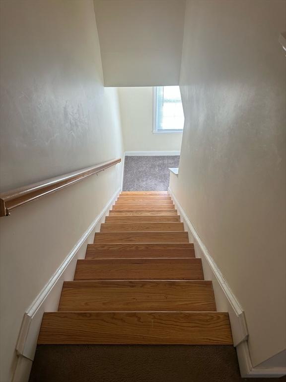 stairway with baseboards