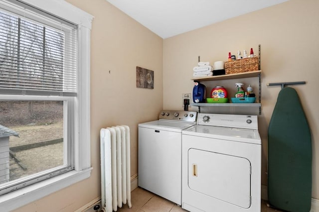47 Moffatt Rd, Salem, MA 01970 - laundry area with radiator heating unit, washing machine and clothes dryer, plenty of natural light, and light tile patterned floors