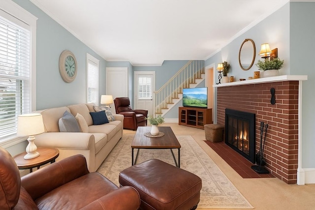 47 Moffatt Rd, Salem, MA 01970 - carpeted living area featuring crown molding, stairs, and a fireplace