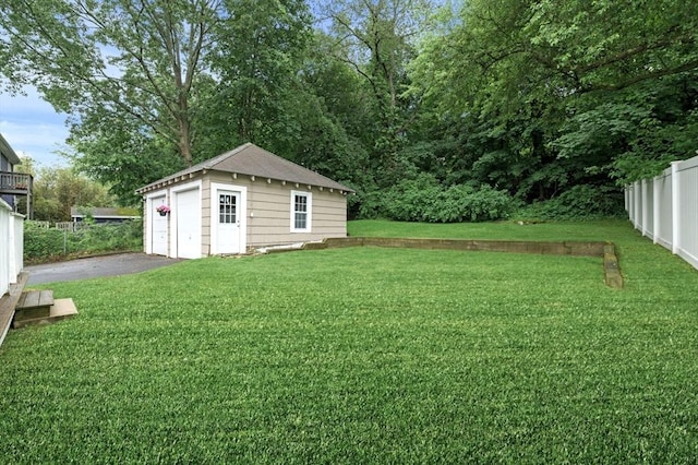47 Moffatt Rd, Salem, MA 01970 - view of yard featuring an outdoor structure and a garage