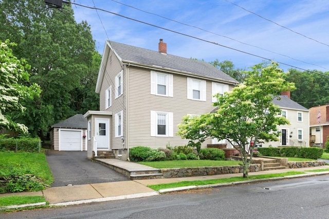 47 Moffatt Rd, Salem, MA 01970 - view of front of property with a chimney, an outbuilding, a detached garage, driveway, and entry steps