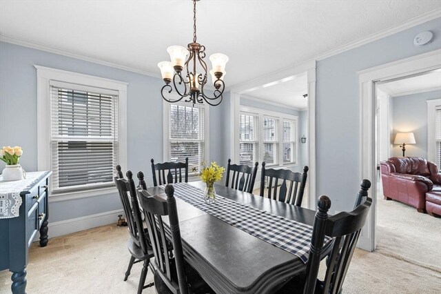 47 Moffatt Rd, Salem, MA 01970 - dining area featuring crown molding, light colored carpet, and a chandelier