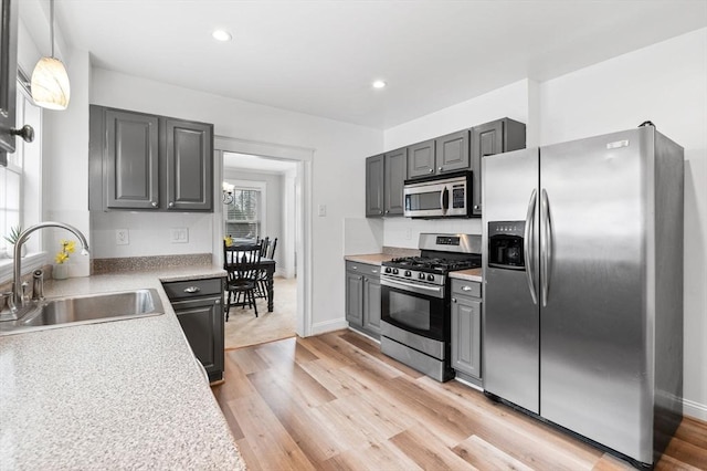 47 Moffatt Rd, Salem, MA 01970 - kitchen featuring appliances with stainless steel finishes, light wood-style flooring, gray cabinetry, light countertops, and recessed lighting