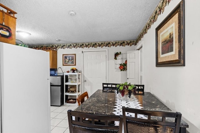 64 Ventura Ln, New Bedford, MA 02745 - dining room with a textured ceiling and light tile patterned flooring