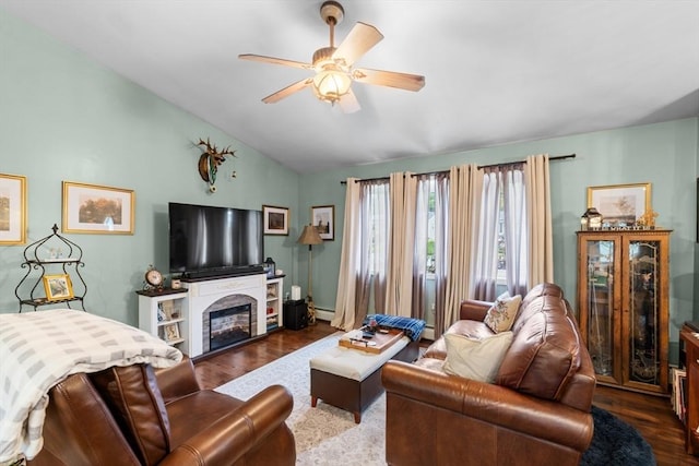 64 Ventura Ln, New Bedford, MA 02745 - living room with wood finished floors, ceiling fan, lofted ceiling, and a glass covered fireplace