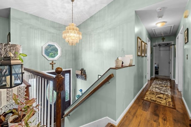 64 Ventura Ln, New Bedford, MA 02745 - hall featuring attic access, wood finished floors, baseboards, an upstairs landing, and a chandelier