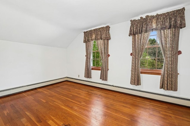 bonus room with vaulted ceiling and wood finished floors