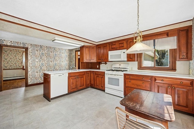 kitchen with white appliances, brown cabinetry, a peninsula, wallpapered walls, and a baseboard heating unit