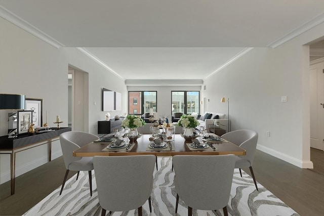 dining area with dark wood-type flooring and ornamental molding