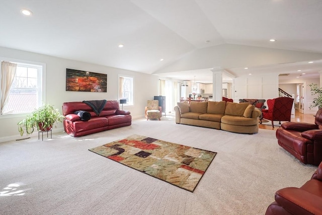 585 Chestnut St, Ashland, MA 01721 - living room with plenty of natural light, lofted ceiling, recessed lighting, and carpet flooring