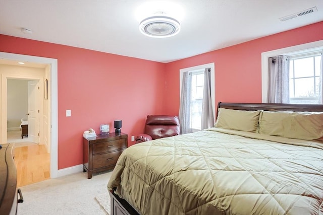 585 Chestnut St, Ashland, MA 01721 - bedroom featuring baseboards, visible vents, and light carpet