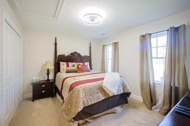 585 Chestnut St, Ashland, MA 01721 - bedroom featuring a closet, baseboards, and carpet