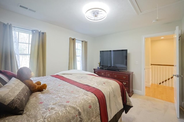 585 Chestnut St, Ashland, MA 01721 - carpeted bedroom featuring multiple windows, baseboards, attic access, and visible vents