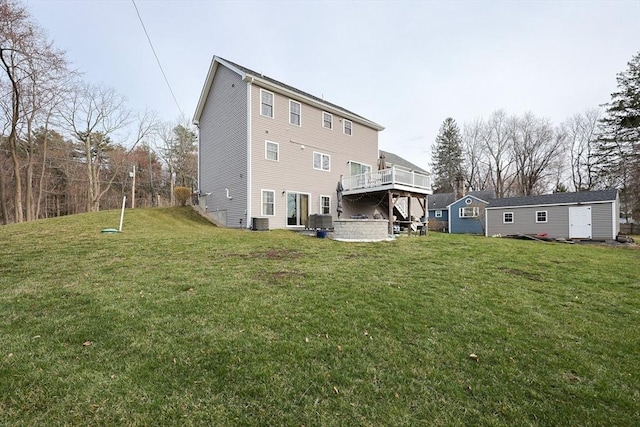 585 Chestnut St, Ashland, MA 01721 - rear view of house featuring a lawn, cooling unit, and a deck