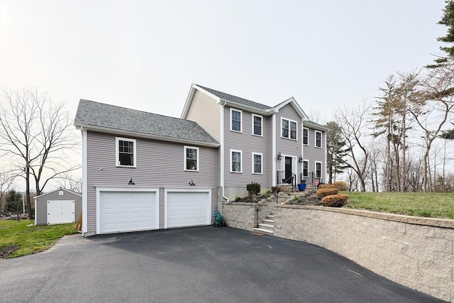 585 Chestnut St, Ashland, MA 01721 - colonial home with an attached garage and aphalt driveway