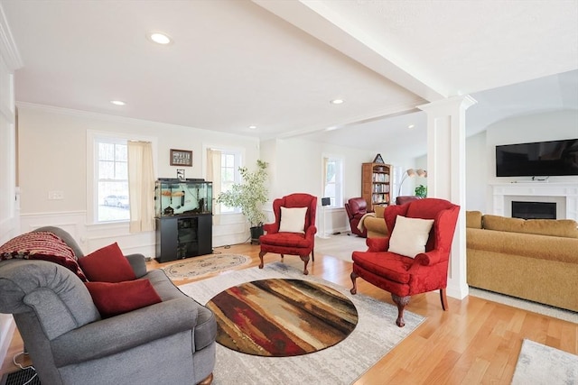 585 Chestnut St, Ashland, MA 01721 - living room with recessed lighting, decorative columns, beamed ceiling, a fireplace, and wood finished floors