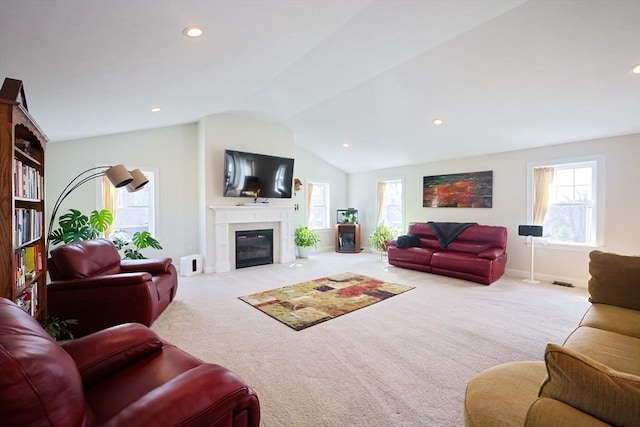 585 Chestnut St, Ashland, MA 01721 - living room featuring carpet flooring, a glass covered fireplace, lofted ceiling, baseboards, and recessed lighting