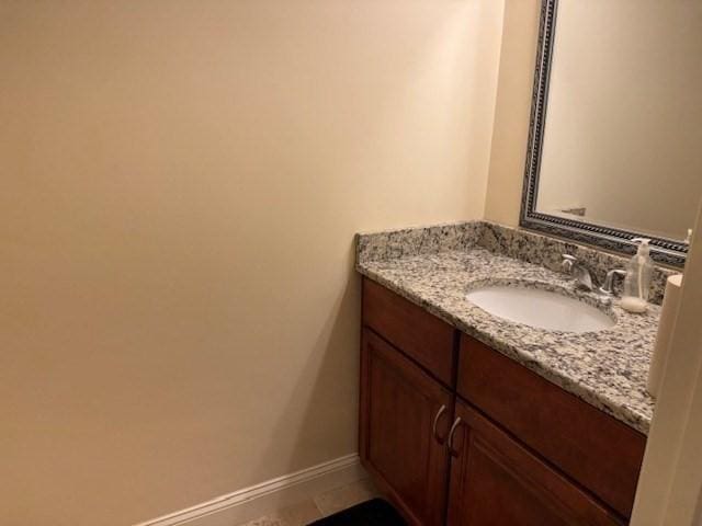 bathroom featuring vanity and baseboards