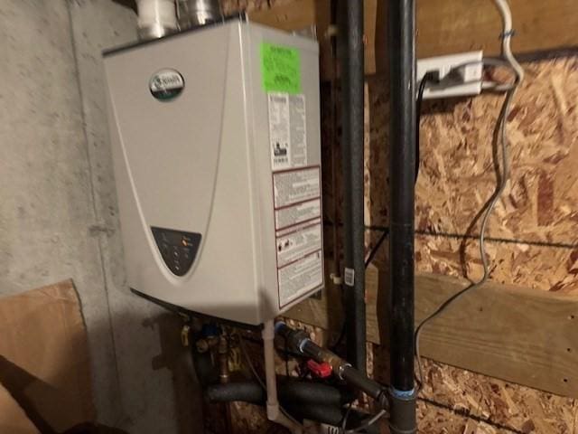 utility room with water heater