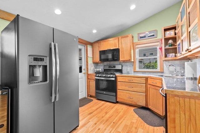13 Elcott Rd, Quincy, MA 02169 - kitchen featuring stainless steel appliances, tasteful backsplash, light wood-style floors, vaulted ceiling, and glass insert cabinets